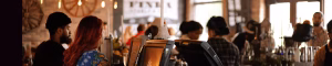  A cosy café in Galway with warm lighting and festive decorations, perfect for a winter visit near The Dawson Hostel.