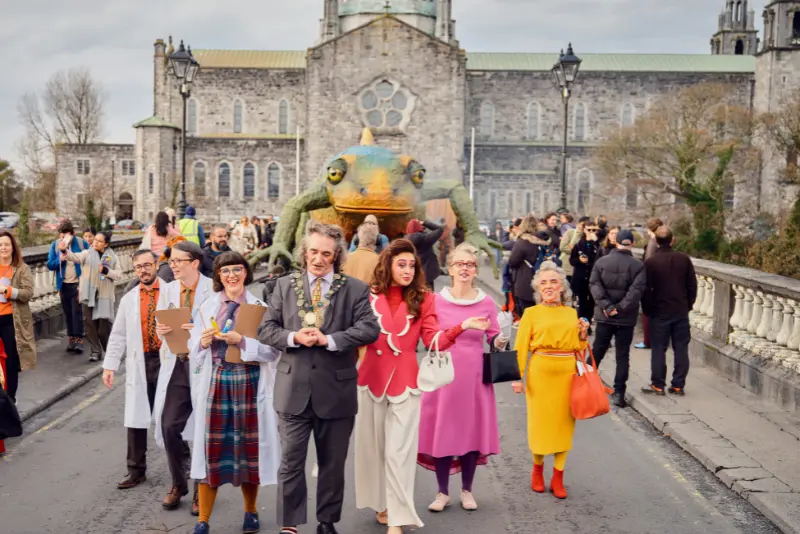 Crowds at the Galway Aboo Halloween Festival parade near Galway Cathedral, celebrating Halloween in Galway with The Dawson Hostel nearby