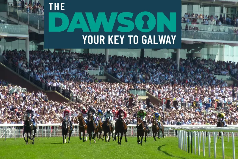 Horses racing past packed grandstands at Ballybrit during Galway Races, where to stay near The Dawson Hostel Galway